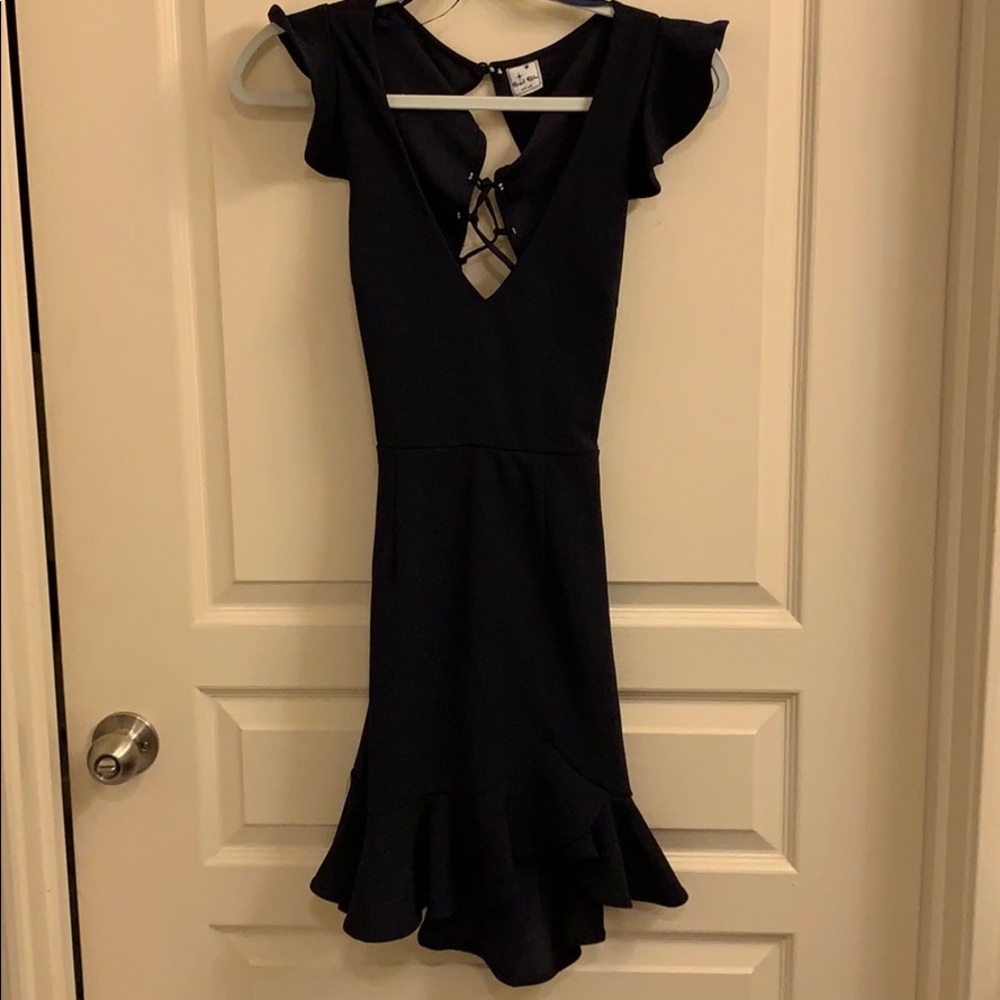 dress with cross cross tie back and ruffles